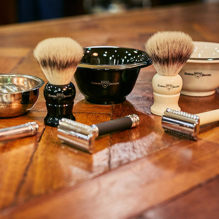 Wet shaving tools on wooden table