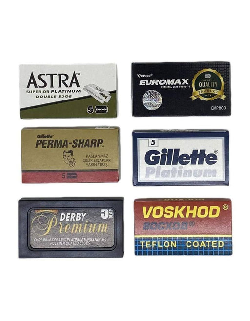 Collection of various brand razor blades on a white background