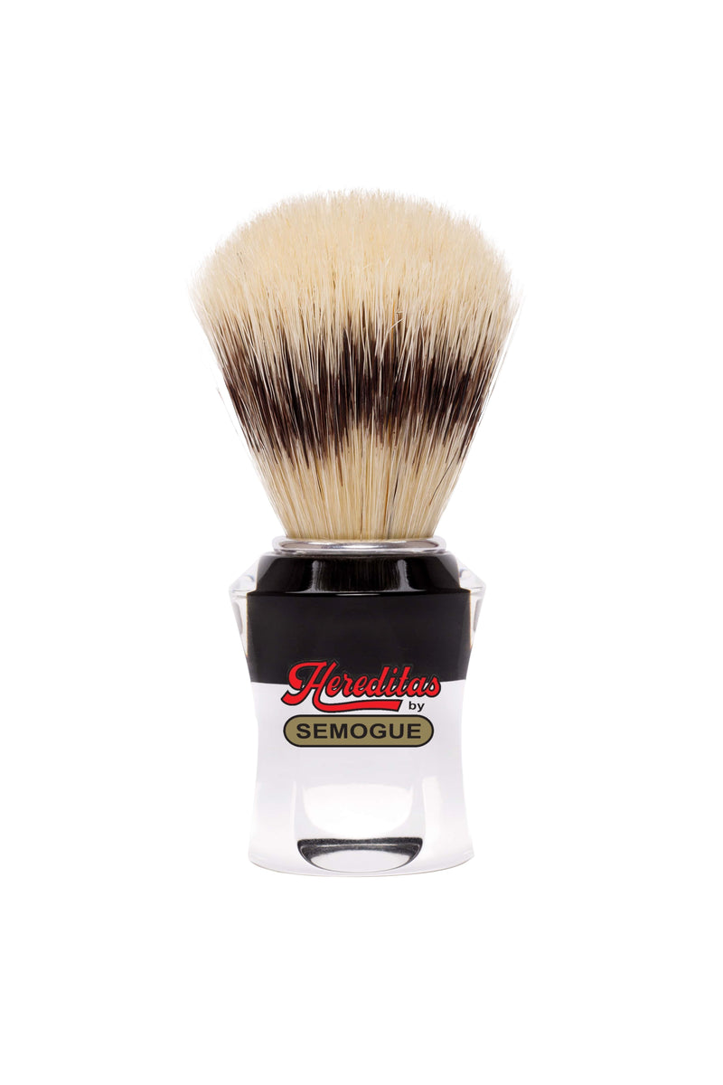 A Semogue 620 Hereditas shaving brush with black and clear striped handle and white boar bristles fan-shaped in knot.