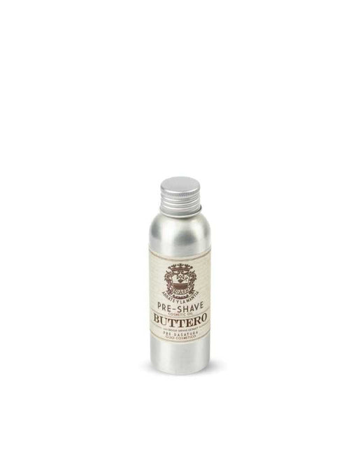 A silver bottle with a label reading 'PRE-SHAVE BUTTERO' containing cosmetic vegetable oil for shaving.