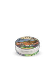 A solid shaving soap puck packaged in a metal tin with a label featuring a colorful illustration and text, indicating it is a product from Abbate y La Mantia, Koke brand, with a weight of 80g.