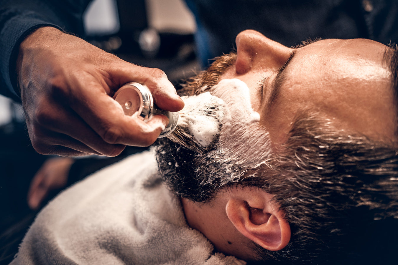 Barber using shaving soap