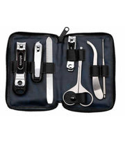 A 7-piece men's grooming kit by Seki Edge, displayed open to show nail clipper, cuticle clipper, nail file, nail clipper for toenails, nose hair scissors, ear cleaner, and slant tweezers, all arranged neatly inside a blue soft case.