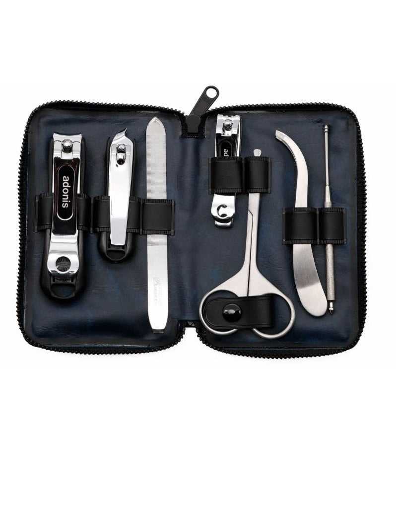 A 7-piece men's grooming kit by Seki Edge, displayed open to show nail clipper, cuticle clipper, nail file, nail clipper for toenails, nose hair scissors, ear cleaner, and slant tweezers, all arranged neatly inside a blue soft case.