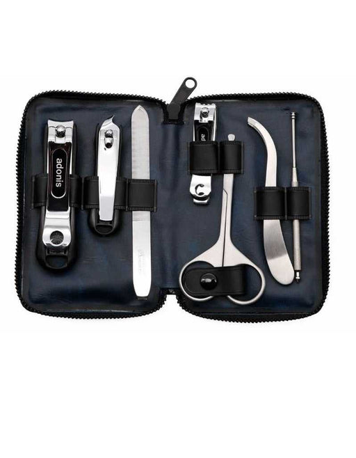 A 7-piece men's grooming kit by Seki Edge, displayed open to show nail clipper, cuticle clipper, nail file, nail clipper for toenails, nose hair scissors, ear cleaner, and slant tweezers, all arranged neatly inside a blue soft case.