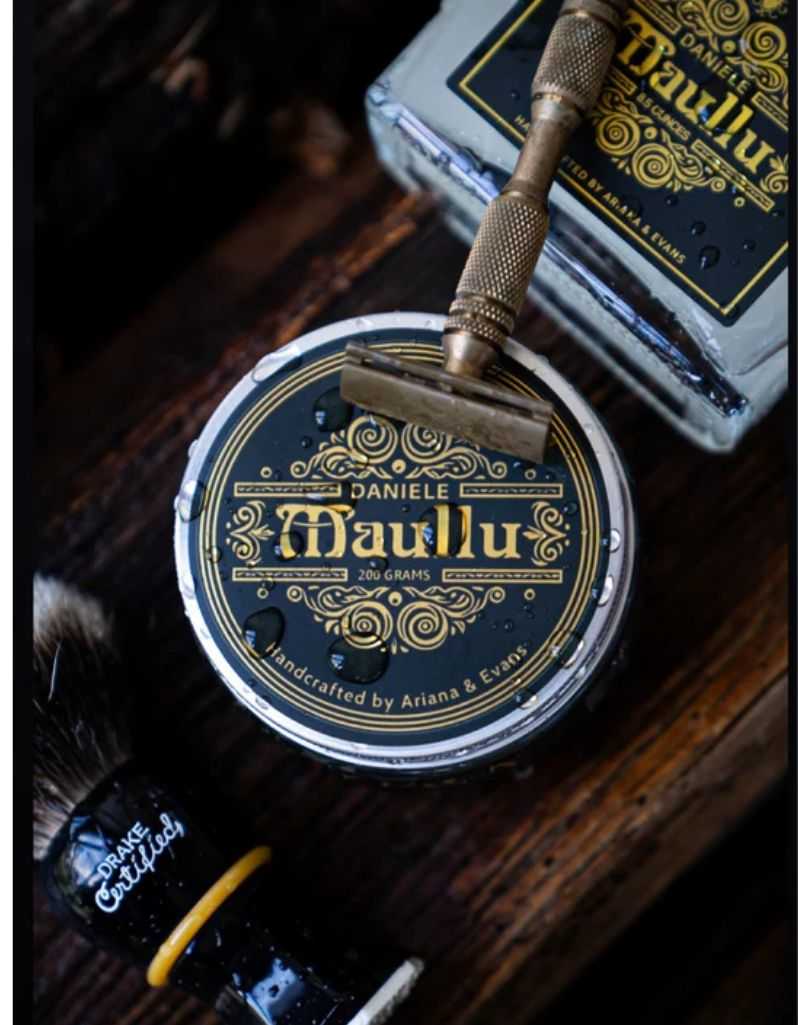 Daniele Maullu Legacy shaving soap tin with ornate black and gold label, barbershop oud scent, wet water droplets