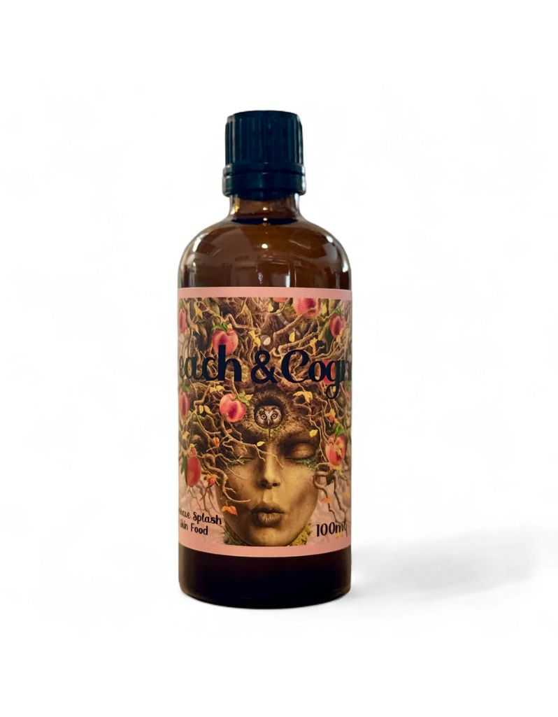 Bottle of Peach and Cognac After Shave Splash and Skin Food with decorative label on a white background