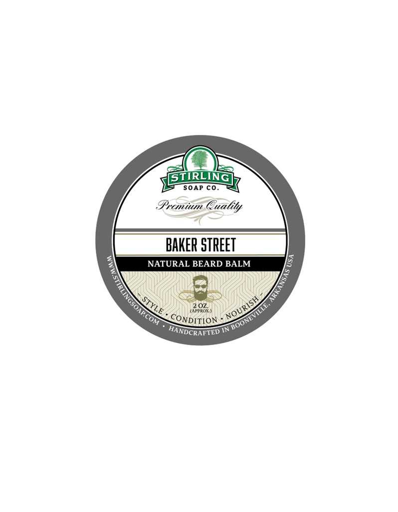 A container of Stirling Soap Co. Baker Street Natural Beard Balm with a label showing the product name and a hint of a classic design.