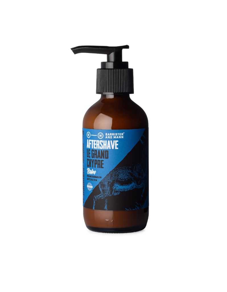 A bottle of Barrister and Mann Le Grand Chypre After Shave Balm with a pump dispenser. The label features a blue color scheme with an image of a man's face, suggesting the use for aftershave
