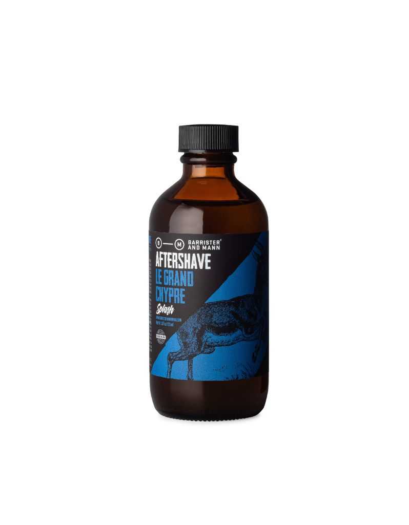 Bottle of aftershave with a blue label on a white background. Le Grand Chypre by Barrister and Mann