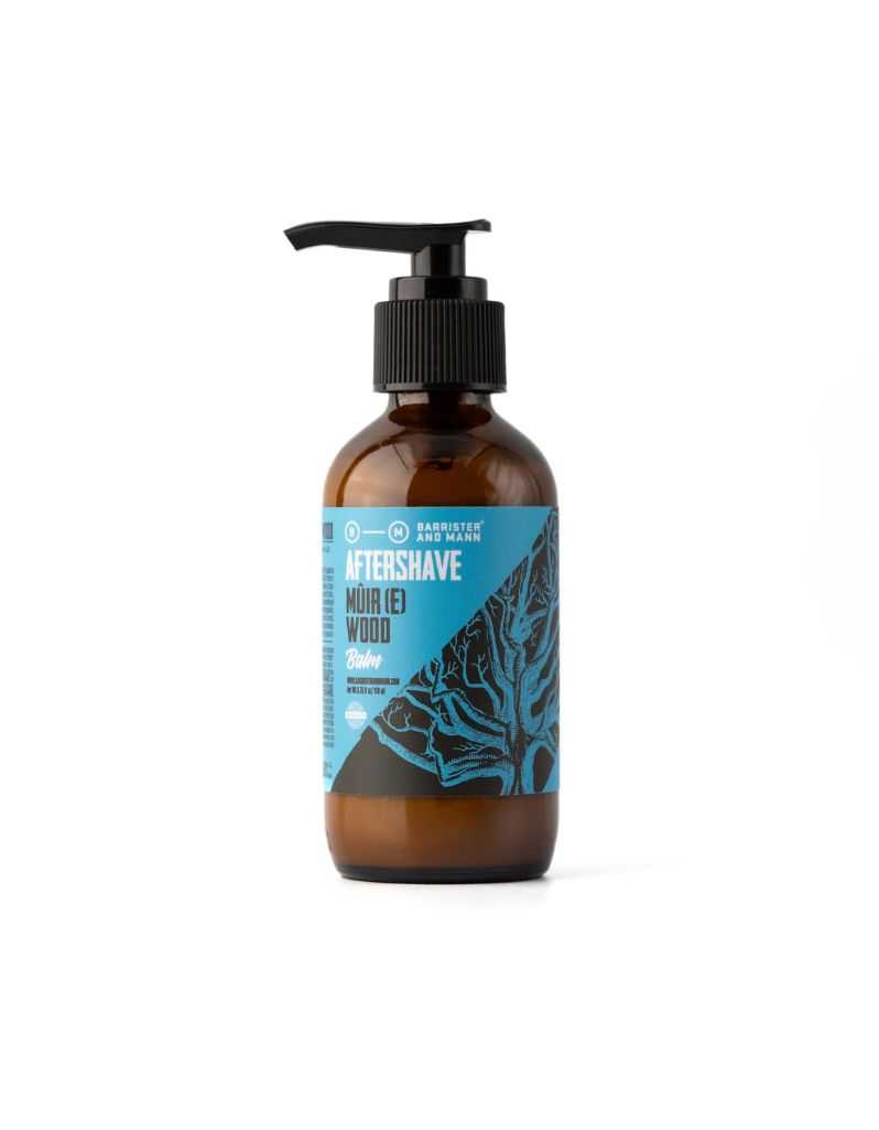 Brown bottle of aftershave with a black pump on a white background. Muire Wood After Shave Balm by Barrister and Mann
