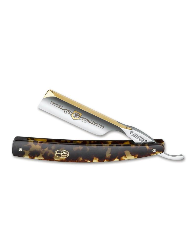 Boker straight razor with tortoiseshell handle on a white background