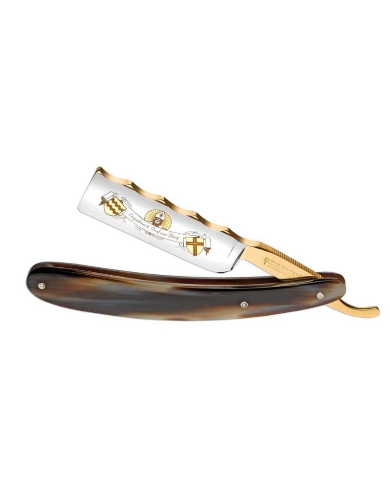 Boker Straight razor with gold and horn handle on a white background