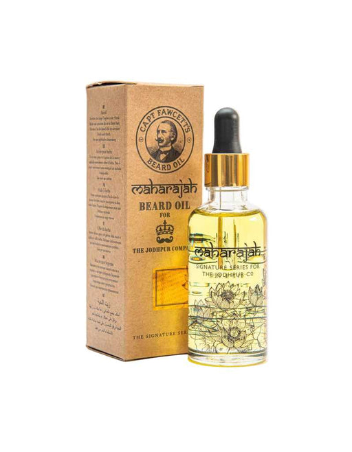 Beard oil bottle with dropper and packaging on a white background