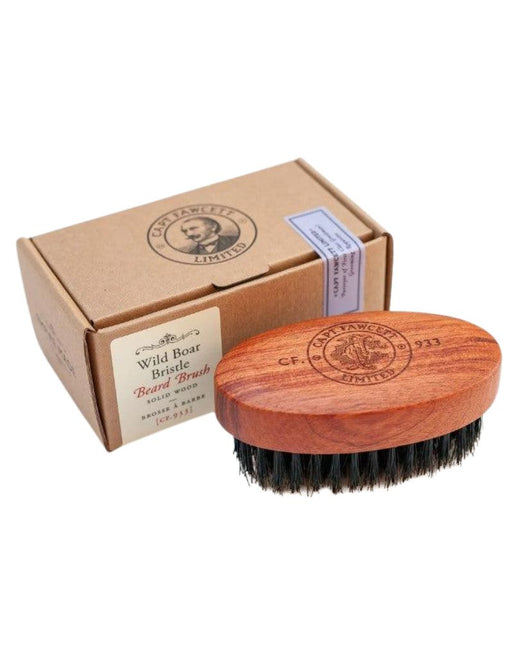Wooden beard brush with brown bristles and packaging on a white background
