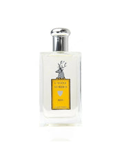 A rectangular glass perfume bottle with a silver cap, featuring a yellow label with a gray stag illustration and the text 'CASTLE FORBIDDEN' and 'KEIG'.