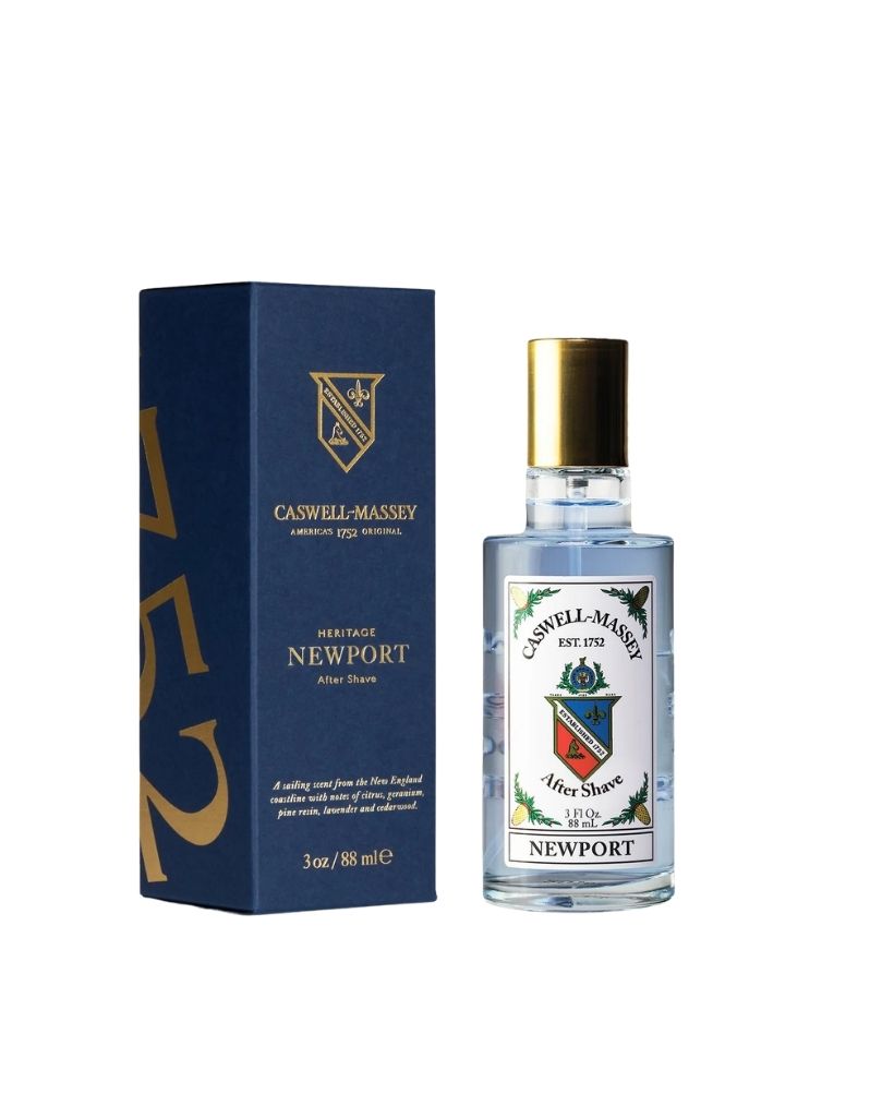 Caswell Massey Newport Heritage After Shave cologne bottle and its navy blue packaging box, displayed on a clean white background.