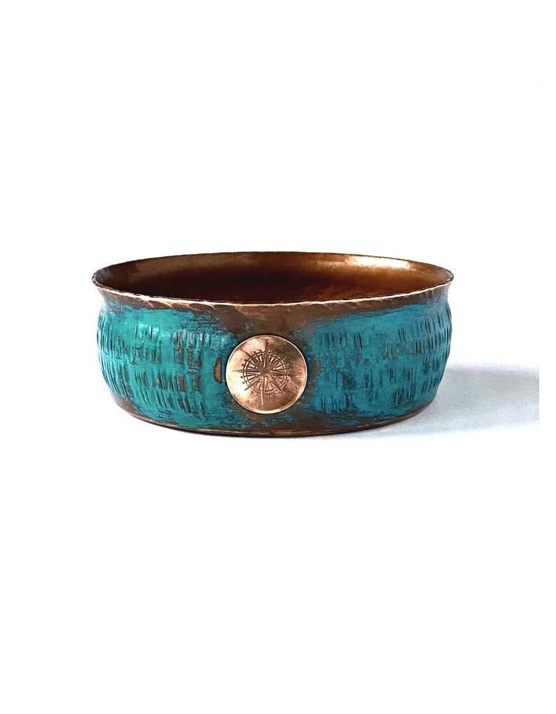 Aquamarine copper shaving bowl with flared rim, ridged interior, distressed finish, and thumb rest for grip and fast lathering.