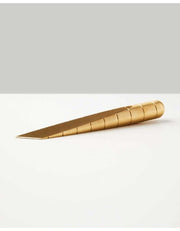 Brass Craighill Desk Knife with patina finish on desk