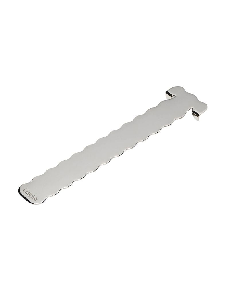 A stainless steel book mark with a wavy profile 
