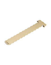 A brass book mark with a wavy profile 