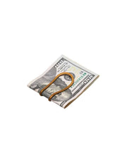 Money clip holding a folded dollar bill on a white background