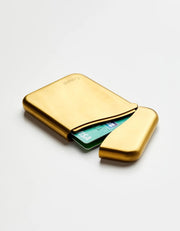 Craighill Summit Card Case in PVD Vapor Brass, open with cards inside