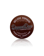 Brown container of Dapper Dan Deluxe Pomade on a white background. Medium hold.