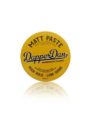 Yellow container of Dapper Dan Matt Paste on a white background