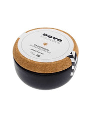 A stoneware container of Dovo shaving cream soap with a cork lid, label visible, on a white background.