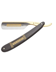 A straight razor with an ebony handle and gold-plated decorations, the blade is silver steel and it has the name 'BISMARCK' engraved on the side.
