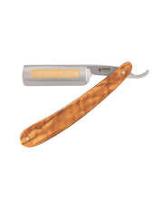 Dovo Inox straight razor with an olive wood handle and a silver-colored blade with a hollow-ground edge, lying on a white surface.