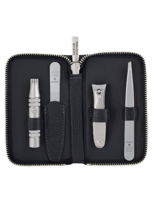 Manicure set with various tools in a black case on a white background