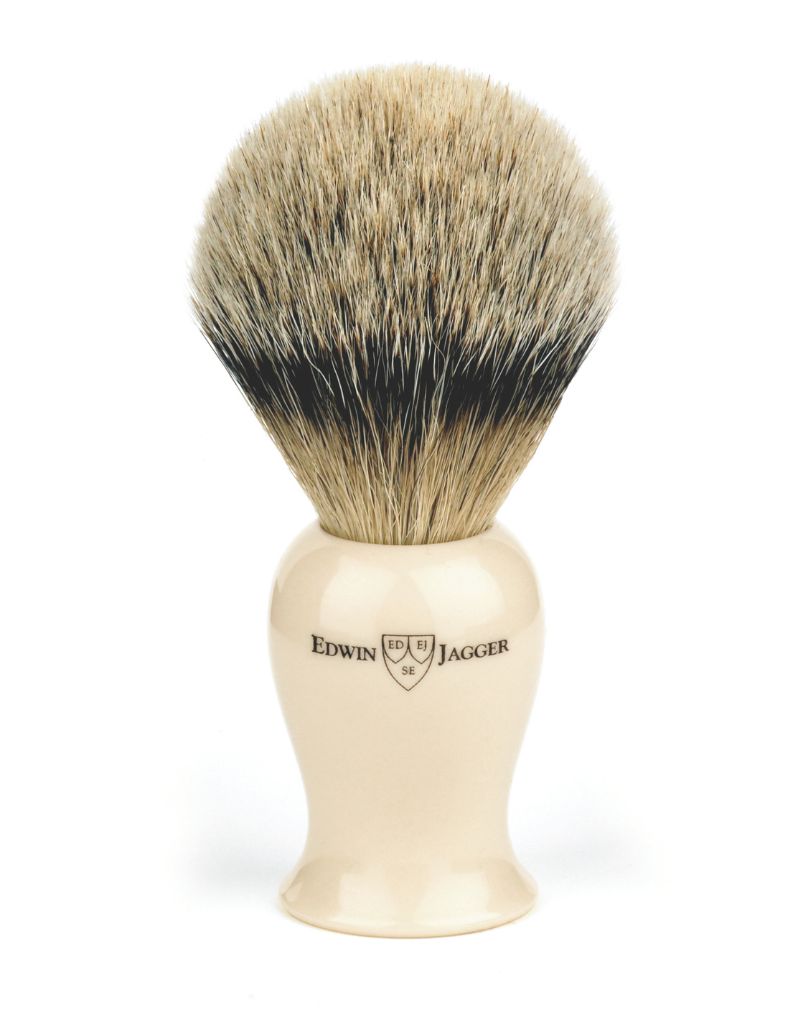 Shaving brush with synthetic hair and wooden handle on a white background, branded 'Edwin Jagger'.