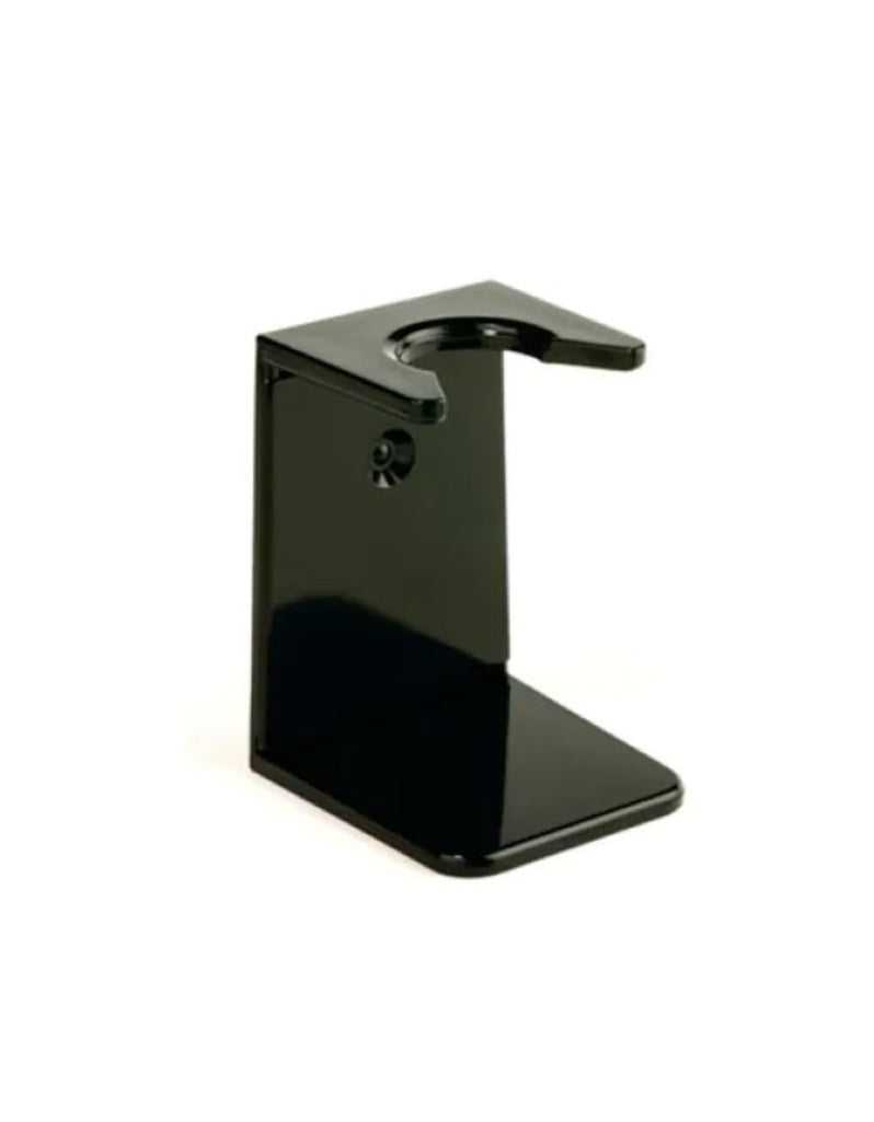 A black Edwin Jagger shaving brush stand with a central opening and a flat base, designed to hold a shaving brush at an angle for drip-off.