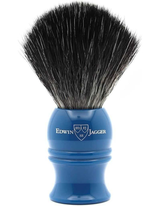 Blue shaving brush with black bristles on a white background, featuring the Edwin Jagger logo.