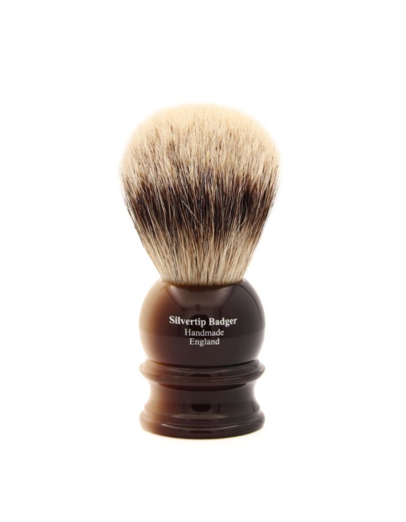Shaving brush with light horn handle and Silvertip Badger bristles on a white background