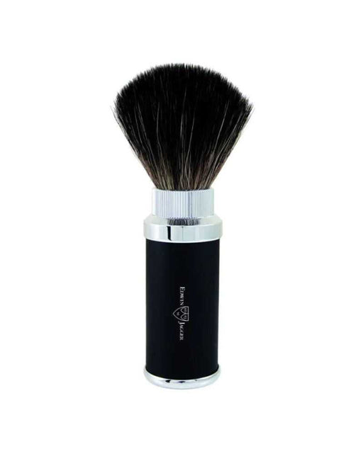 A black Edwin Jagger travel shaving brush with a metal handle and synthetic bristles, displayed upright against a white background.