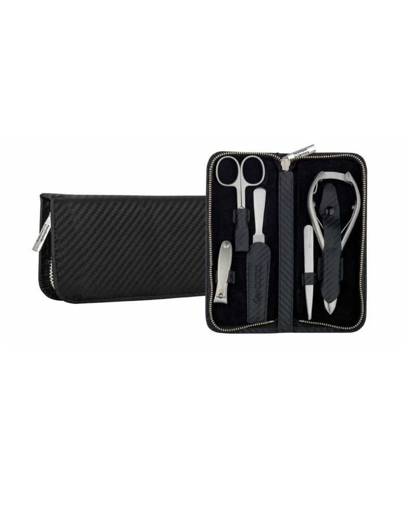 A 5-piece manicure set by Erbe Solingen, including stainless steel tools such as combination scissors, tweezers, nail file, and nail clippers, displayed in an open black zipper pouch with a carbon pattern.
