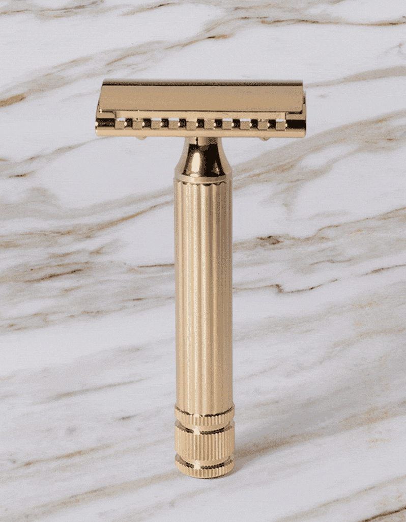 Fatip l’Ibrido Classic gold safety razor rotating to show both sides of its hybrid open and closed comb head