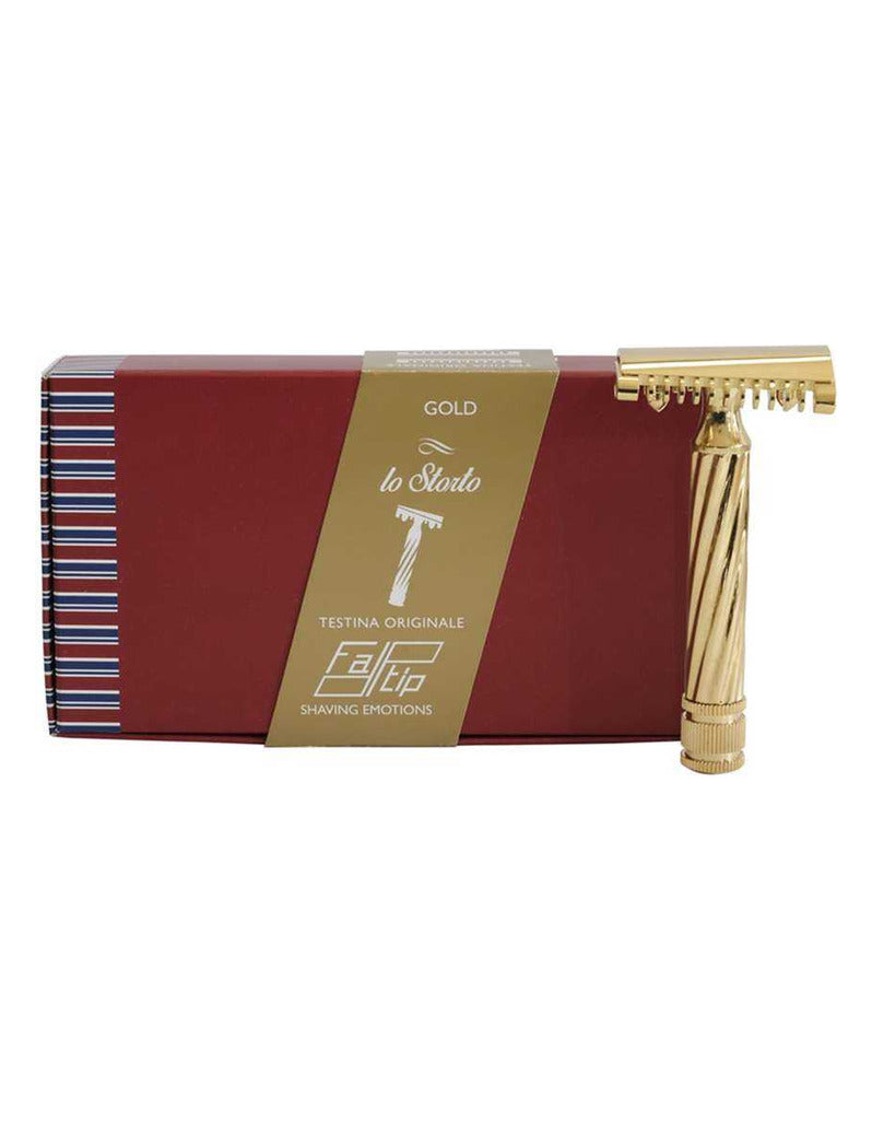 Fatip Lo Storto gold open comb safety razor with a twisted handle, shown beside its red Testina Originale gift box