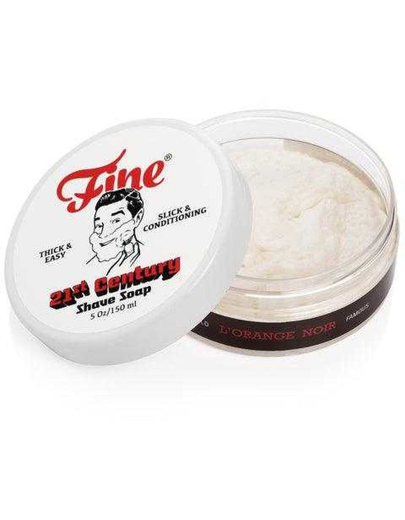 Open tub of Fine L'Orange Noir 21st Century shave soap showing the soft white soap beside its lid
