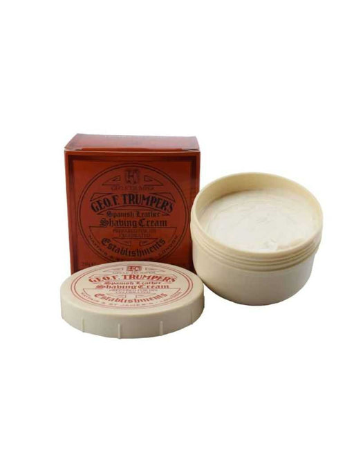 A bowl of Geo. F. Trumper Spanish Leather Soft Shaving Cream next to its packaging box.