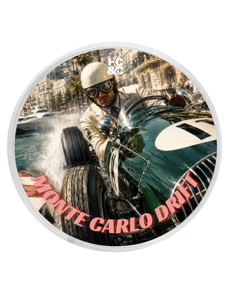 Hendrix Classics & Co. Monte Carlo Drift Shave Soap lid with a vintage green race car speeding along the Monaco harbor