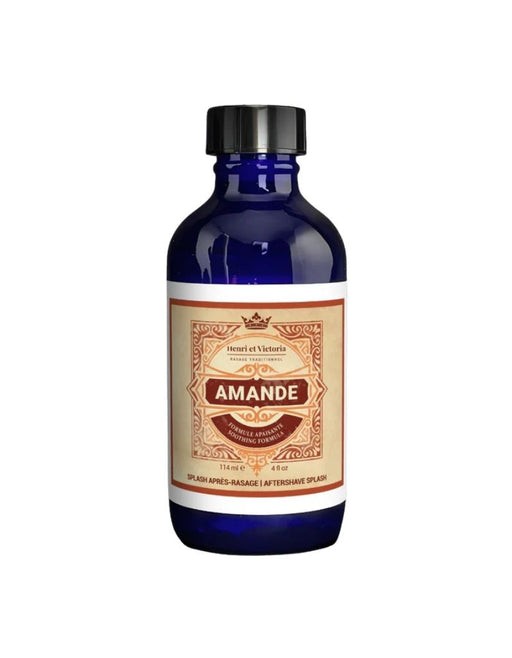 Bottle of Amande aftershave splash with a decorative label on a white background