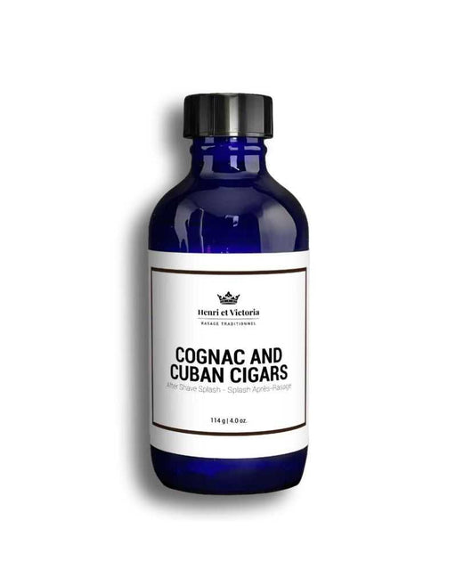 A blue bottle labeled 'Henri Et Victoria Cognac and Cuban Cigars Aftershave Splash', with a capacity of 114ml.