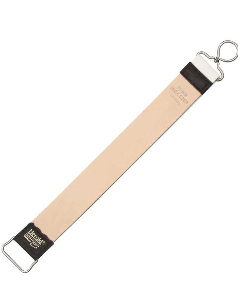 A leather razor strop with a brown handle and a metallic clasp, primarily beige in color with black detailing.