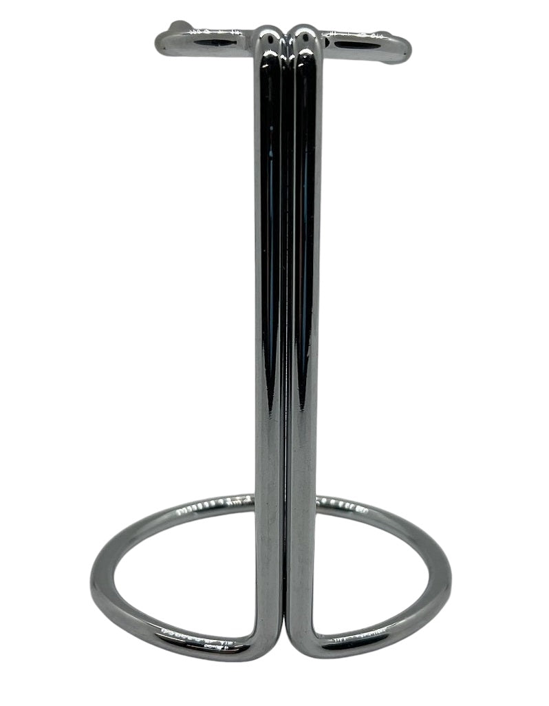 A basic metal brush stand with a chrome finish.