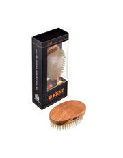 Wooden brush with packaging featuring the Kent logo on a white background
