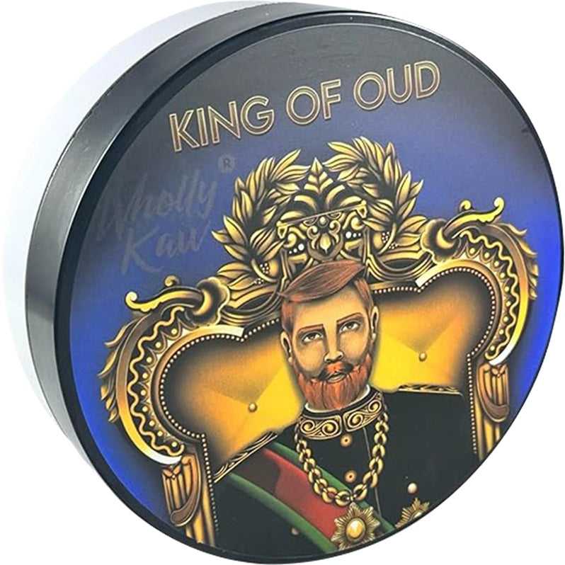 Wholly Kaw King of Oud Shaving Soap container with ornate blue and gold label featuring a crowned king illustration.